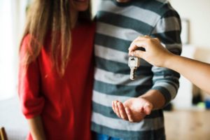 couple getting keys to house