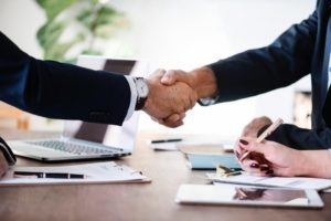 two people shaking hands