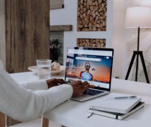 person at a desk looking at computer